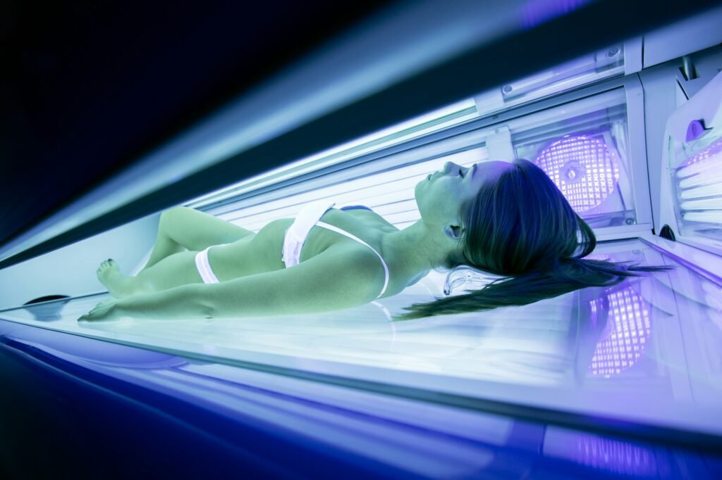 Beautiful woman lying in solarium