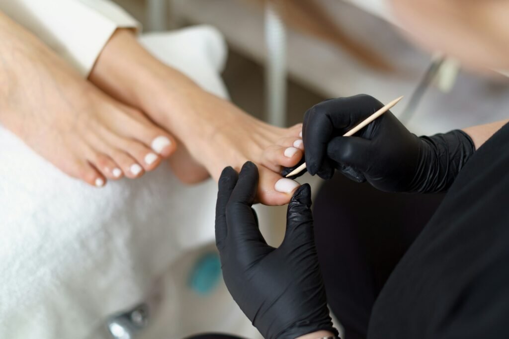 Woman making pedicure in beauty salon